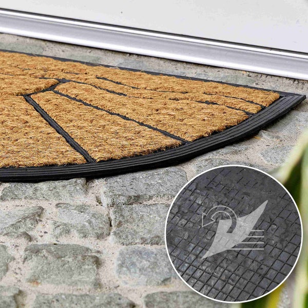 Fußmatte aus Kokosfasern mit Gummirand und Anti-Rutsch-Symbol.