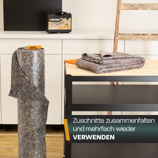 Szene mit einer Rolle Abdeckvlies, einer gefalteten Abdeckplane und einer Leiter im Hintergrund.
