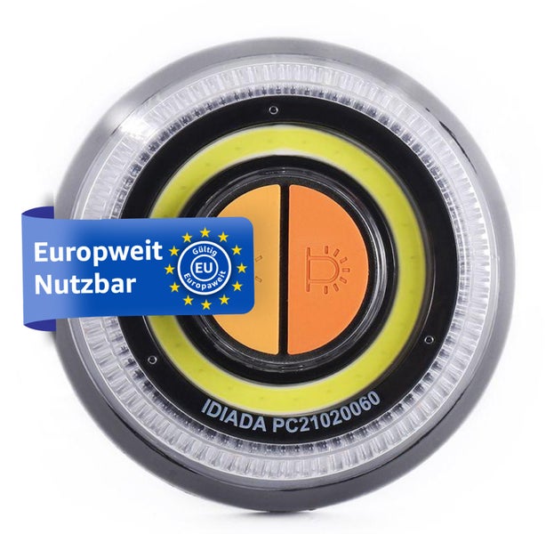 Runde Arbeitsleuchte mit zwei Knöpfen und Aufkleber 'Europaweit Nutzbar'