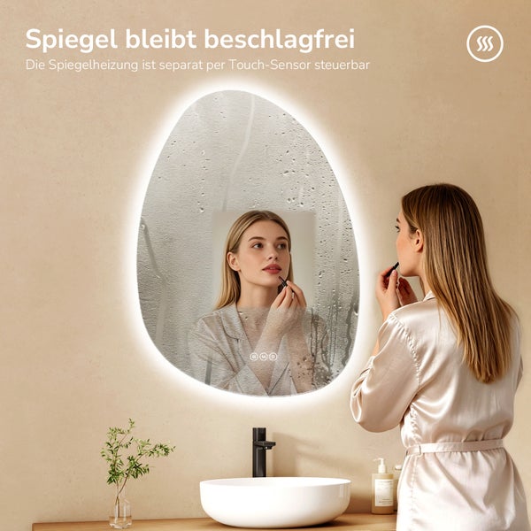 Organisch geformter LED-Badspiegel mit Heizfunktion gegen Beschlagen, Touch-Sensor und indirekter Beleuchtung über einem Waschbecken.