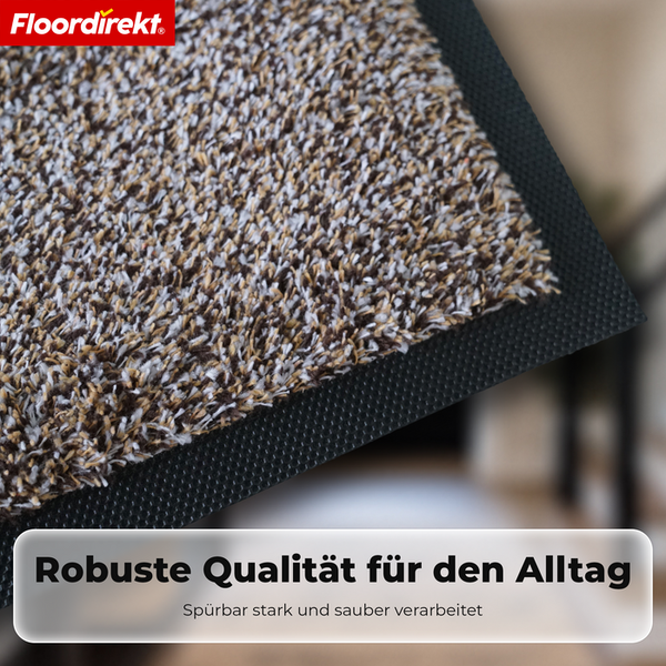 Floordirekt Logo. Schmutzfangmatte mit strukturierter Oberfläche und robustem Gummirand für den täglichen Gebrauch.