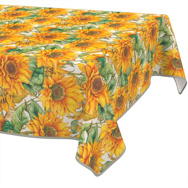 Tischdecke mit Sonnenblumen-Motiv und grünen Blättern.