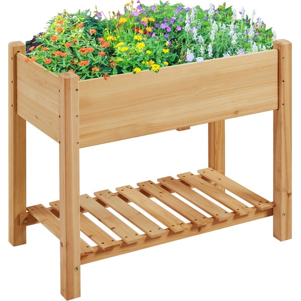 Hochbeet aus Holz mit Ablagefläche, bepflanzt mit bunten Blumen.