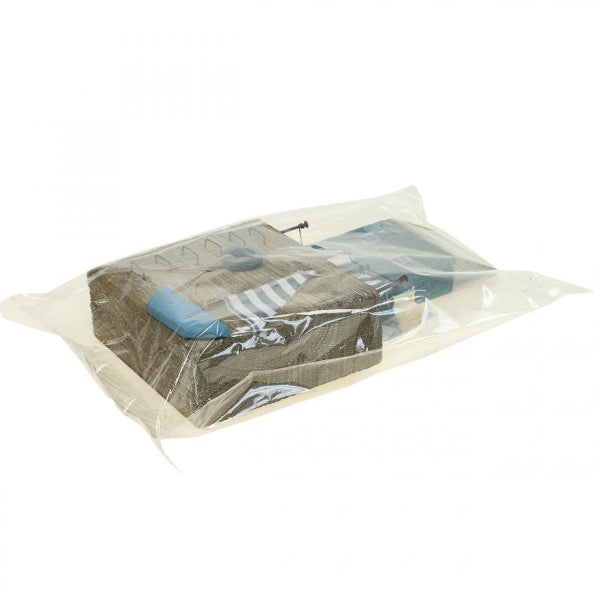 Verpackte Serviette mit Hausmotiv