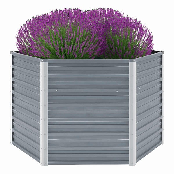 Sechseckiges Hochbeet aus Metall mit bepflanzter Heidekraut-Dekoration zur Gartengestaltung.