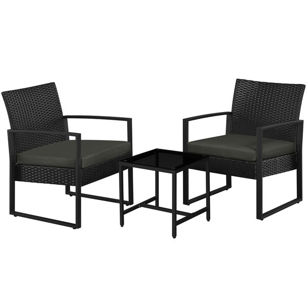 Gartenmöbelset mit zwei Rattansesseln und einem Tisch mit Glasplatte