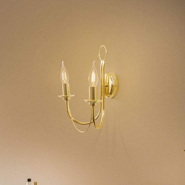 Goldene Wandleuchte mit zwei Lampen
