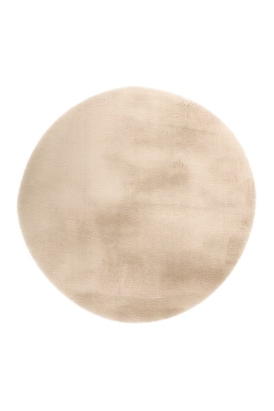 Runder Teppich in Beige aus weichem Hochflor.