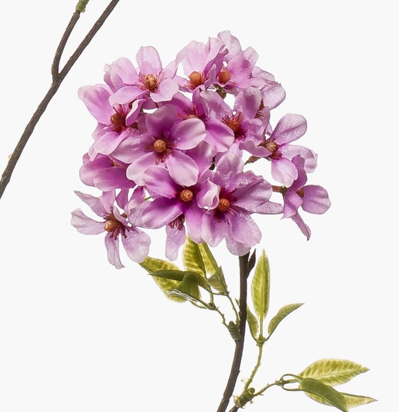 Künstlicher Blütenzweig mit lila Blüten und grünen Blättern.