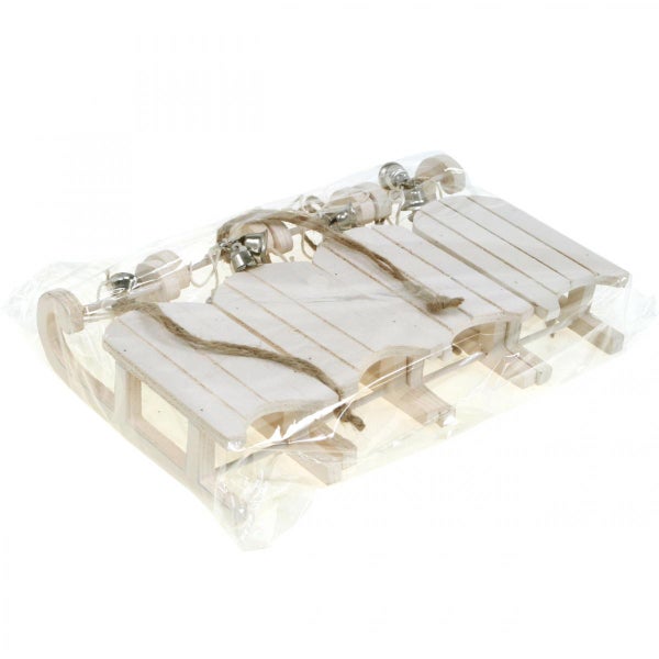 Dekorativer Holzschlitten mit Glöckchen zur Weihnachtszeit