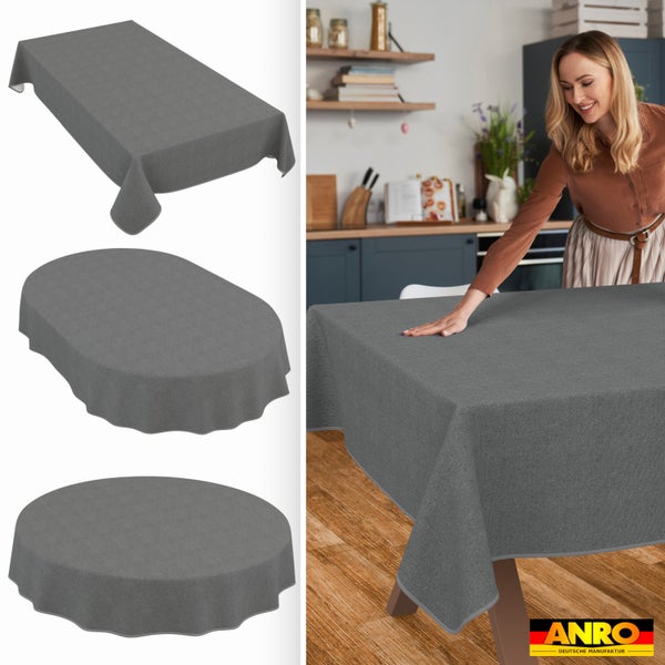 Graue Tischdecke in rechteckiger, ovaler und runder Form, in einer hellen Küche auf einem Tisch aus Holz. ANRO Logo.