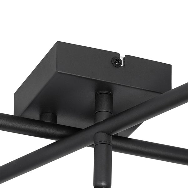 Detailaufnahme einer schwarzen Deckenleuchte mit rechteckiger Deckenhalterung und Metallstäben.