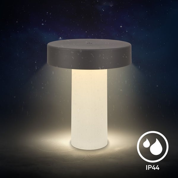 LED Akku Tischleuchte für außen, IP44 spritzwassergeschützt, in Pilzform mit warm leuchtendem geriffeltem Sockel.