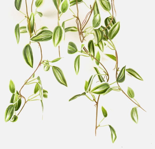 Künstlicher Zweig mit grünen und weißen Knospen sowie gelblichen Blüten an einem braunen Stiel.