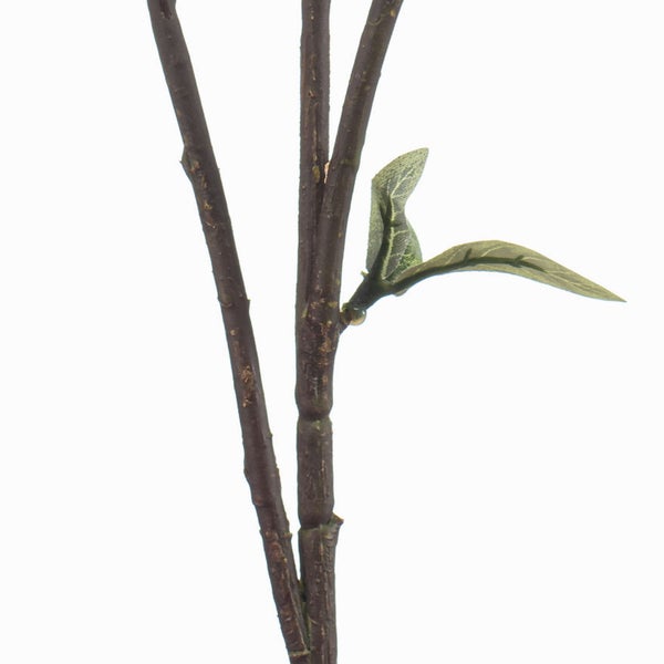 Künstliche Cycas Palme im schwarzen Topf mit grünen Wedeln und strukturiertem braunem Stamm.