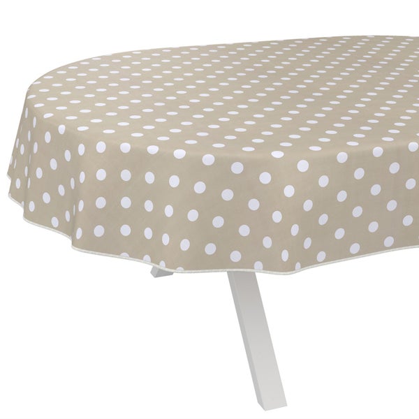 Tisch mit beiger Tischdecke und weißen Punkten