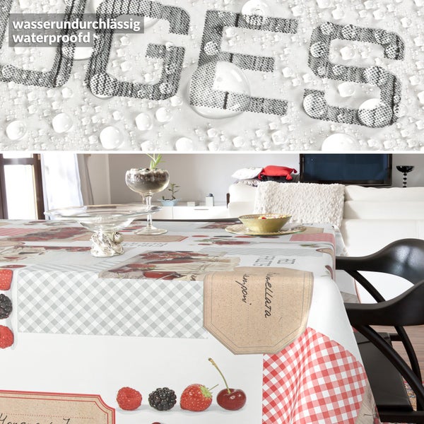 Tischdecke mit wasserundurchlässiger Beschichtung und Früchtedekor auf einem Tisch