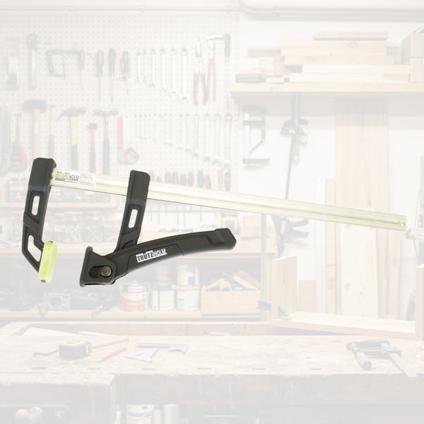 Trutzholm Einhandzwinge mit stabiler Stahlschiene und Kunststoffbacken für präzises Spannen und Fixieren von Werkstücken in der Werkstatt.