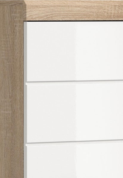 Detailansicht einer Möbelfront in Eiche-Optik mit weißen Hochglanz-Lamellen.