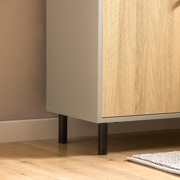 Detailaufnahme eines Sideboards mit Holzdekor und Füßen