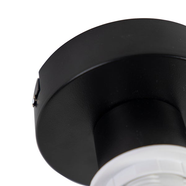 Schwarzer runder Deckenbaldachin aus Metall für eine Leuchte.