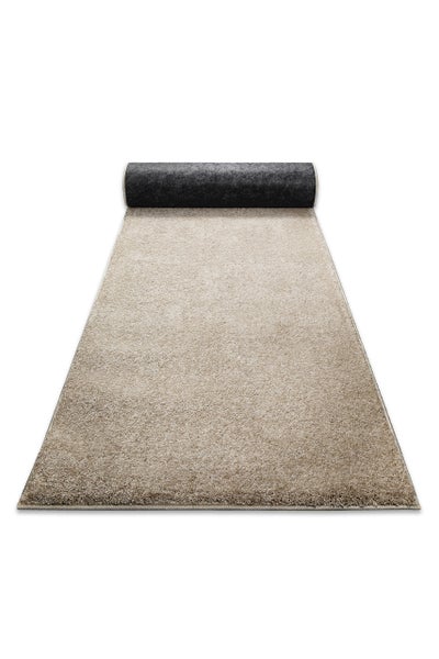 Teppichläufer mit Hochflor in Beige, rechteckig, am Ende teilweise aufgerollt.