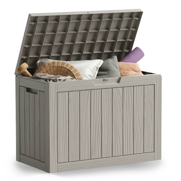 Offene Gartenbox in Holzoptik gefüllt mit Kissen, einer Matte und einem Korb.