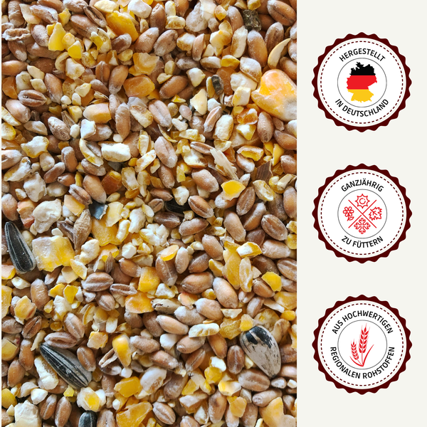 Vogelfutter mit Sonnenblumenkernen und Getreide sowie Siegel: Hergestellt in Deutschland, ganzjährig zu füttern, aus hochwertigen regionalen Rohstoffen