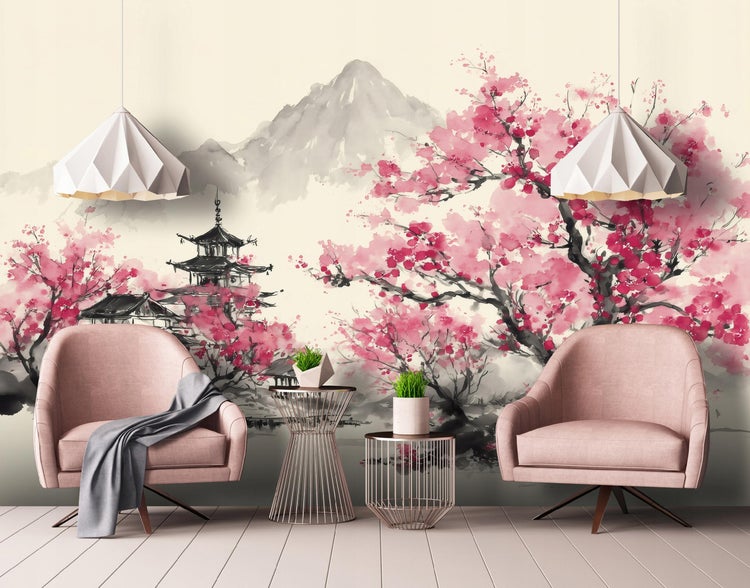 Fototapete mit japanischem Landschaftsmotiv, Kirschblüten, Pagode und Bergen im Aquarellstil in einem hellen Wohnzimmer mit rosa Sesseln.
