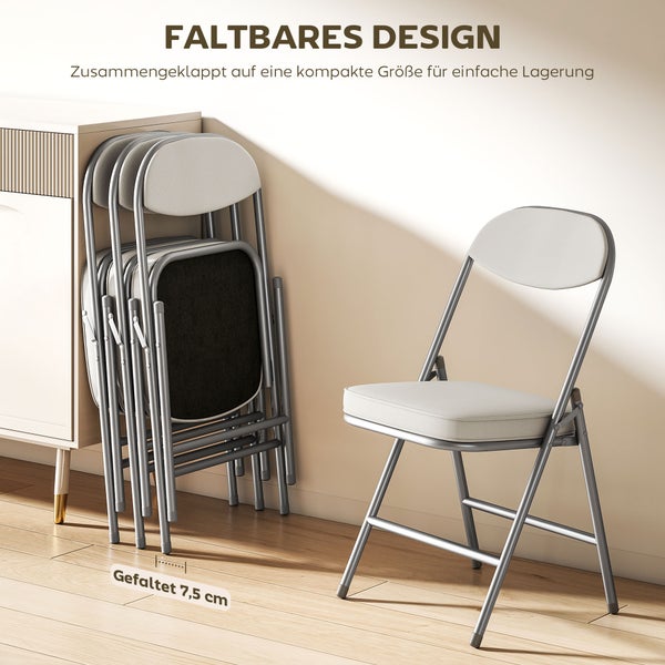 Runder Esstisch mit Holzfuß und vier Klappstühlen auf einem Teppich