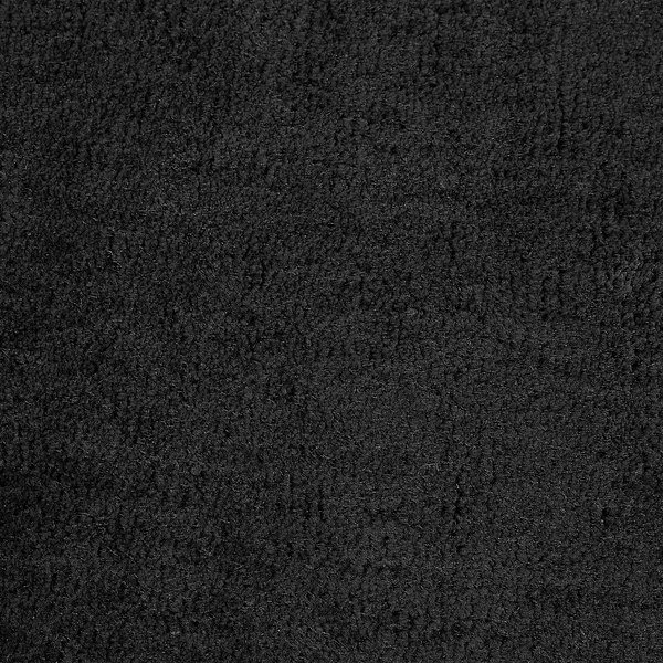 Nahaufnahme der Oberflächenstruktur eines hochflorigen Teppichs mit dichter Textur.