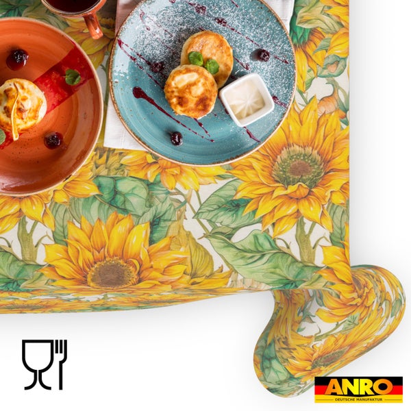 Tischdecke mit Sonnenblumenmuster und grünen Blättern, lebensmittelecht, ANRO Logo.