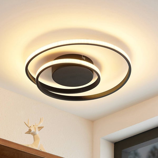 Moderne LED-Deckenleuchte in Ring-Optik, schwarzes Metallgehäuse, warmweißes Licht, zeitloses Design für Wohnräume.
