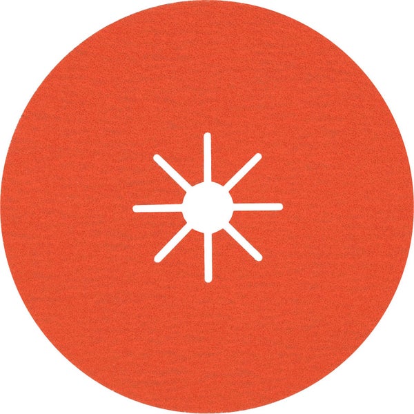 Eine Person mit Handschuhen hält eine Schleifscheibe für einen Winkelschleifer, daneben eine Schleifscheibe und eine X-Lock Scheibe.