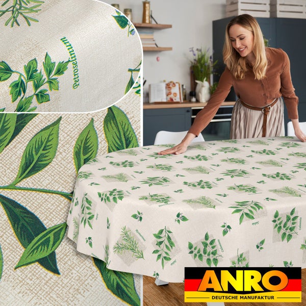 Ovale Tischdecke mit Kräutermotiven wie Petersilie und Rosmarin in einer hellen Küche. Detailansicht der Gewebestruktur und ANRO Logo.
