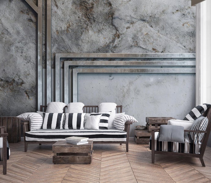 Wohnzimmer mit Sofa, Sessel, Kissen und Couchtisch aus Holz