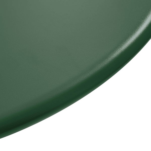 Detailaufnahme einer dunkelgrünen, strukturierten Oberfläche mit abgerundeter Kante.