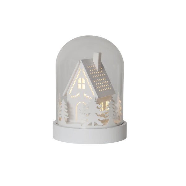 Dekorative Schneekugel mit Haus und Tannenbaum für die Weihnachtszeit