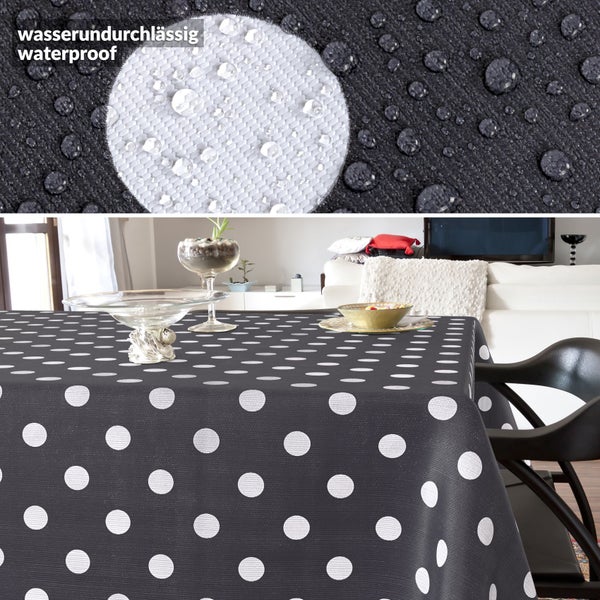 Wasserabweisende Tischdecke mit Punktemuster auf einem Tisch sowie Detailansicht des Materials mit Wassertropfen.