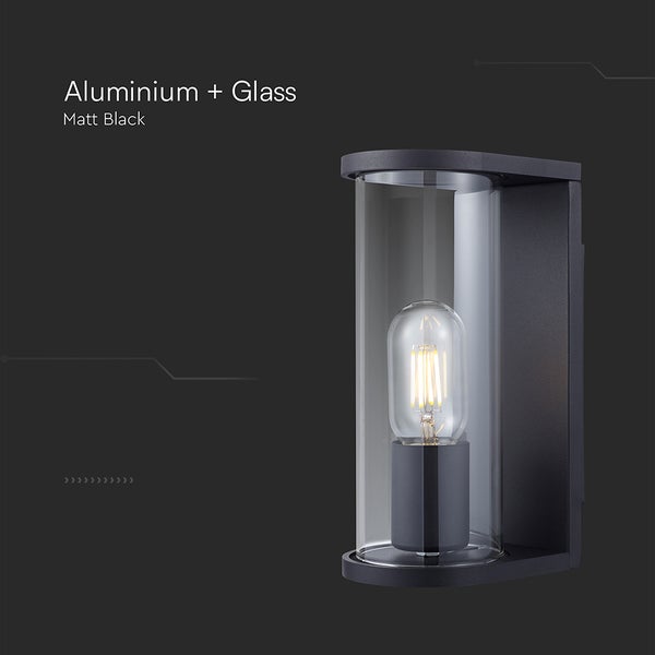 Zylindrische Außenwandleuchte aus Aluminium und Glas in Mattschwarz mit sichtbarem Leuchtmittel.