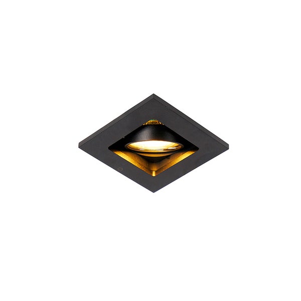 Quadratischer Einbaustrahler in Schwarz mit goldener Innenseite und eingeschaltetem Leuchtmittel.
