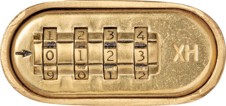 Kombinationsschloss aus Metall mit vier Zahlenrädern und Markierung XH.