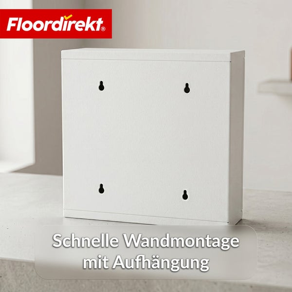 Floordirekt Logo über einem weißen Metallschrank in der Rückansicht mit vier Schlüssellochbohrungen für die einfache Wandmontage.