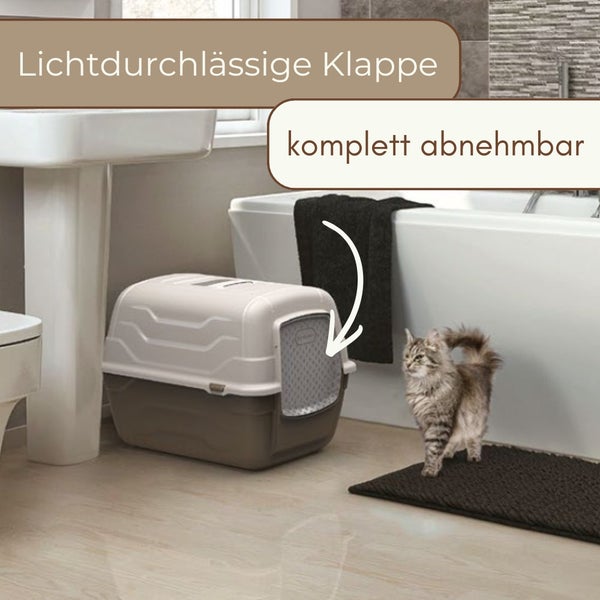 Geschlossene Katzentoilette mit lichtdurchlässiger Klappe und komplett abnehmbarer Haube in einem Badezimmer neben einer Katze.