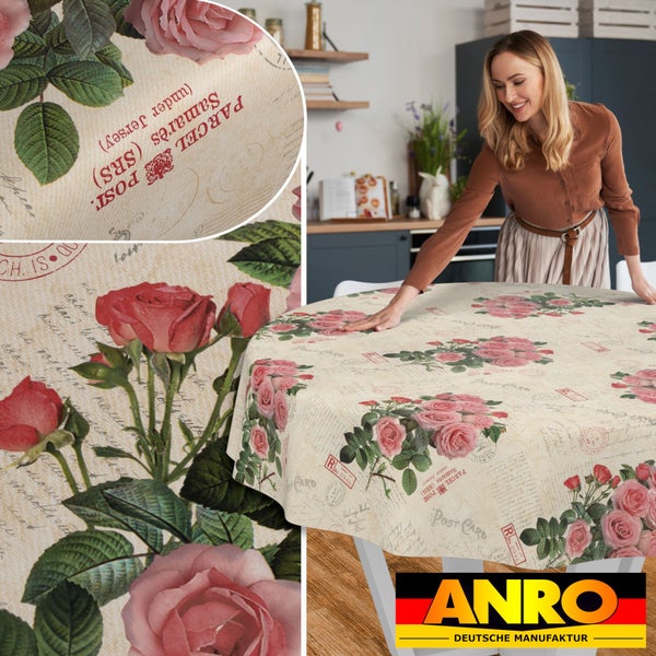 Runde Tischdecke mit Rosen- und Vintage-Postkarten-Motiv auf einem Tisch in einer hellen Küche, Detailansichten des Musters, ANRO Logo.