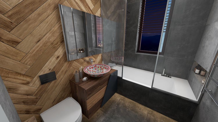 Badezimmer mit Badewanne, Toilette, Waschtisch und Spiegel