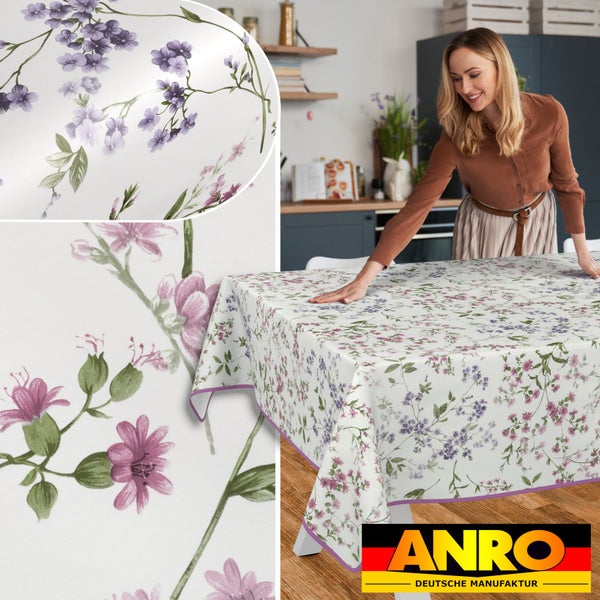 Tischdecke mit Blumenmuster und Frau im Hintergrund