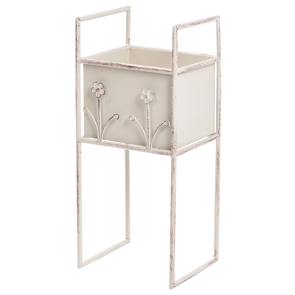 Weißer Blumenständer aus Metall im Vintage-Design mit rechteckigem Pflanzkasten und dekorativen Blumenmotiven auf einem hohen Gestell.