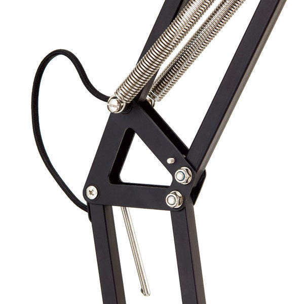 Detailaufnahme einer schwarzen Schreibtischlampe mit Federmechanismus