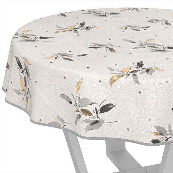 Runde Tischdecke mit grauem und goldenem Blattmuster sowie kleinen Punkten.